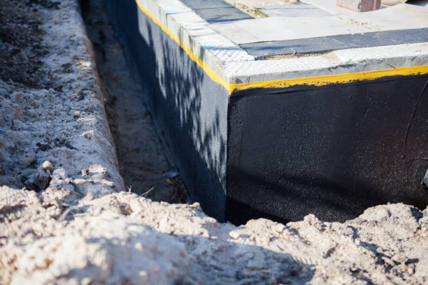 Professional Basement Waterproofing technician working in Westphalia, MI
